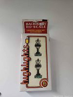 Front of sealed Bachmann box showing two HO scale crossing signals