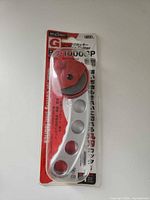 Front view of packaged NT Cutter RO-1000GP showing red blade guard and model details