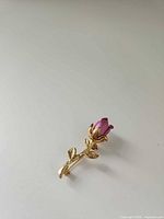 Full view of brooch on neutral background