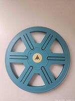 Front view of blue plastic movie reel
