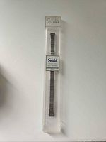 Front view of Speidel watch band sealed in clear plastic case