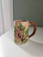 Front view of Shafford RCMP mug showing raised Mountie and horse design