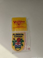 Front view of sealed Voyageur Alberta patch showing header card and embroidered design