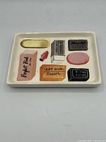 Top view of ceramic dish showing full eraser illustration layout