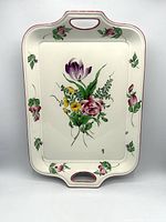 Front view vertical orientation displaying floral pattern and handles