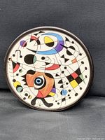 Front view showing full abstract design and rim