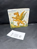 Front view of the hand-painted griffin tile