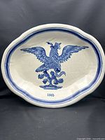 Full view of oval platter showing eagle motif, border, and inscription