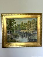 Frontal view of framed landscape painting