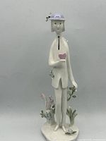 Full front view of figurine showing overall form and details