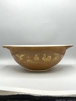 Side view showing Early American gold motifs and handle-spout profile