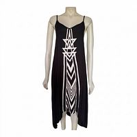 Full front view of black maxi dress with white geometric print and handkerchief hem on mannequin