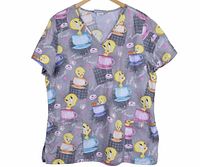 Full view of V-neck scrub top front showing overall print and shape
