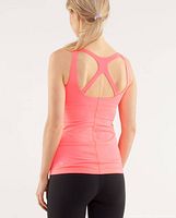 Back view of pink Optimal tank top on mannequin showing cross-back straps and seam lines