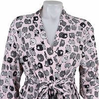 Upper torso and collar displaying sheep print and belt