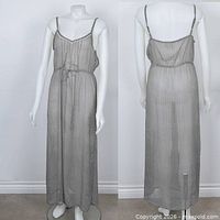 Front view of black and white sheer chiffon maxi dress on mannequin