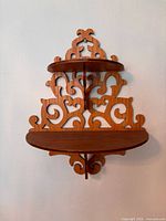 Full front view showing fretwork design and two tiers