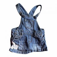 Full front view showing bib pocket, straps, floral patch, overall condition