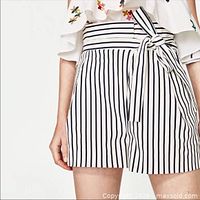 Model view front of striped shorts with belt