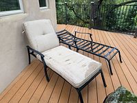 Both chaise lounges side by side on deck, one with cushion, one without