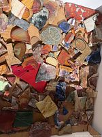 overview showing large quantity of mixed stone slabs covering tray