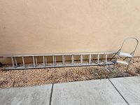 Extension ladder and step ladder side by side for scale