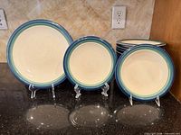 Group view of dinner, salad plates and bowls showing pattern