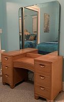 Front view of vanity showing mirror, twin pedestals and overall finish