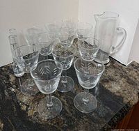 Group shot of all stemmed glasses, pitcher, and vodka measure on countertop