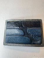 Front view of Arabesque Designs belt buckle showing geometric pattern