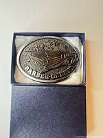 Front view of silver-tone Barber-Greene buckle in presentation box