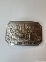 Front view showing CAT D10 tractor relief and embossed text