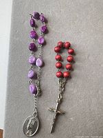Overall view of both decade rosaries showing beads, crucifix, medal