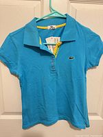 Front view showing color, collar, logo, tags attached