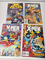 All four comic books laid out showing full covers
