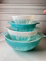 Stacked view of all four Butterprint Cinderella bowls showing pattern and alternating colors