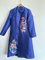 Royal blue satin long coat with phoenix and floral embroidery front view