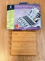 Retail box showing Gourmet Traditions 19-Piece Knife Set graphics and bamboo board