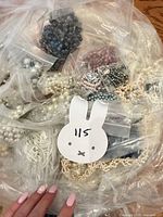 Assorted bagged faux pearl and bead jewelry pieces