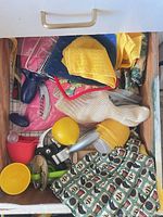 Drawer of assorted utensils, cloths, juicer and tools