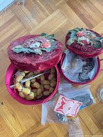Open jewelry boxes showing rosary and bagged jewelry