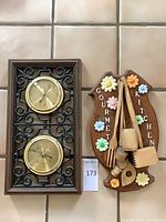 Both items side by side: weather station and kitchen plaque