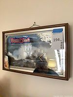 Front view showing beach scene print, clock face, wooden frame