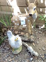 Group shot showing fawn, hen and broken lizard statues