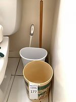 All four items positioned together beside toilet