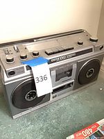 Front view showing speakers, cassette deck, tuner