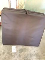 Folding mattress standing upright folded