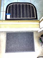 Both doormats shown in place, half-moon above threshold and rectangular below