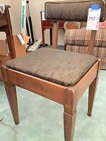 Full view of wood dining chair showing frame, upholstery, and leg condition