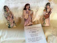Three porcelain angel ornaments with certificate in original feathered packaging